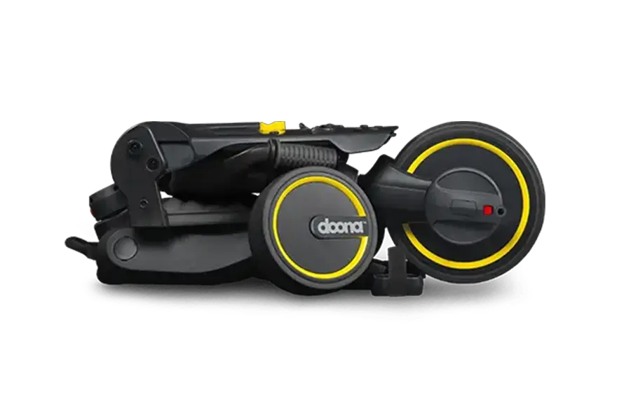 Zusammengeklapptes schwarzes Doona Liki Trike S3 Dreirad